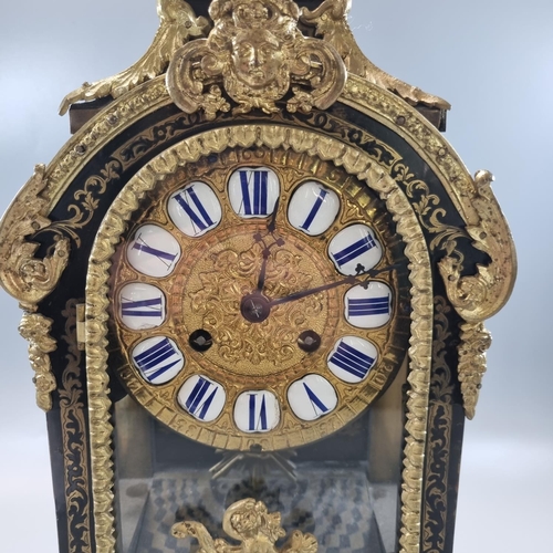 58 - 19th century French boulle mantle clock marked 'F Dumouguie', the arched case with gilt metal cherub... 