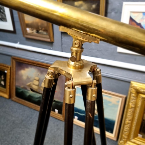 64 - Reproduction brass telescope with folding and adjustable tripod.  Overall length 97cm approx.  (B.P.... 