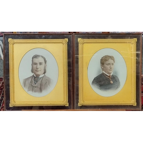 67 - Pair of late Victorian overpainted photographic portraits on opaline glass, gentleman and lady, with... 