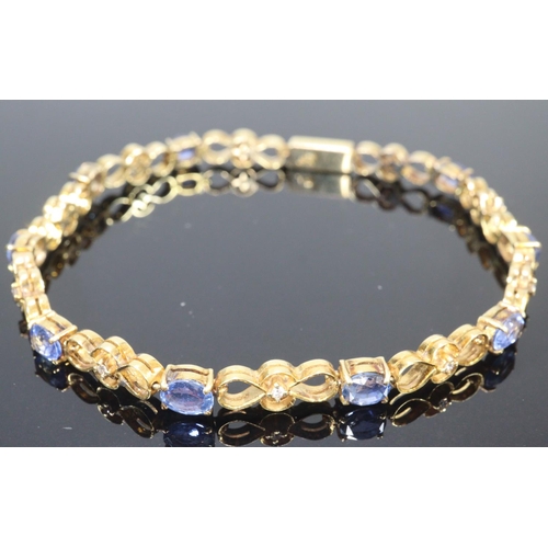 272 - 18ct gold 19 stone diamond and sapphire bracelet.  18.5cm long approx.  (B.P. 21% + VAT)