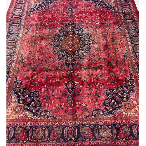 391 - Large multi-coloured ground Persian Mashad floral and foliate carpet. 378 x 293cm approx. 
(B.P. 21%... 