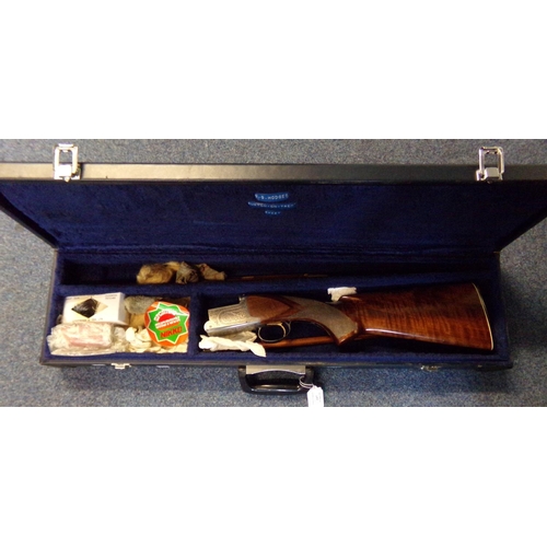 197 - Stock and action only of a Nikko 12 bore over and under shotgun with scroll engraved decoration and ... 