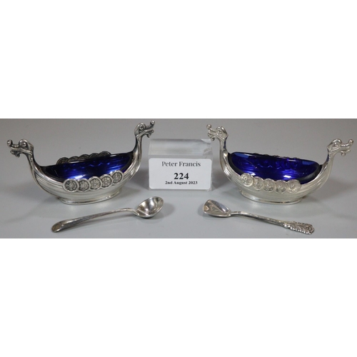 224 - Pair of Norwegian silver salts with blue glass liners in the form Viking boats with two spoons, one ... 