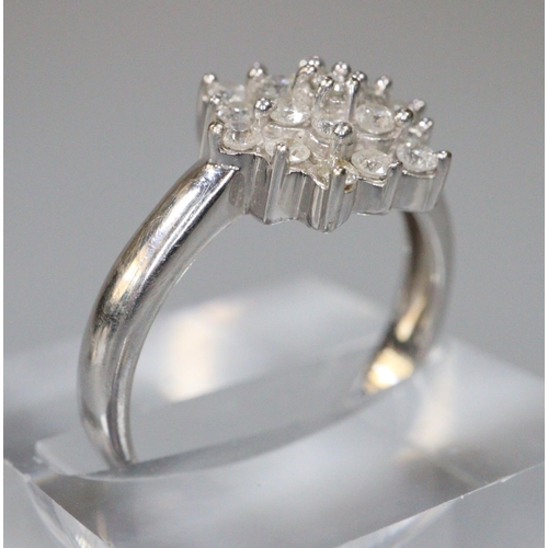 271 - 9ct white gold diamond cluster ring.  Size M.  3.2g approx.  (B.P. 21% + VAT)