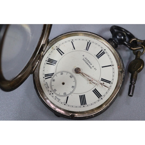 310 - Silver keyless lever open faced pocket watch with Roman face and seconds dial, together with a silve... 