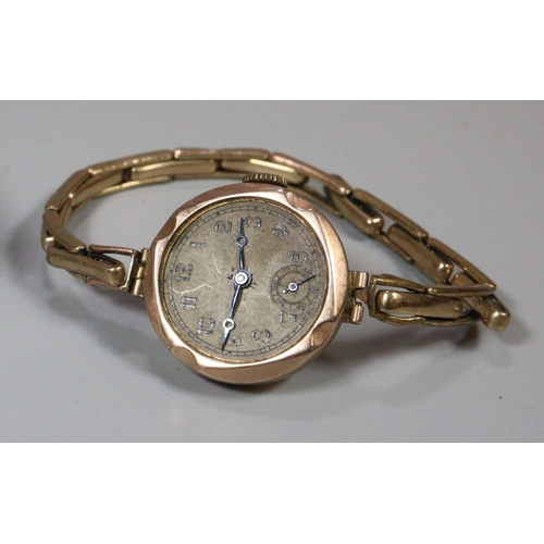 313 - 9ct gold vintage ladies wristwatch with Arabic face and seconds dial on plated expanding bracelet.  ... 