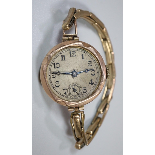 313 - 9ct gold vintage ladies wristwatch with Arabic face and seconds dial on plated expanding bracelet.  ... 