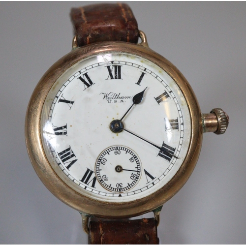 314 - Vintage Waltham gold wristwatch with Roman face having seconds dial, on a leather strap.  Total weig... 