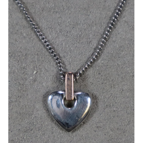 323 - Clogau silver necklace and a silver and gold Clogau Cariad pendant.  (B.P. 21% + VAT)