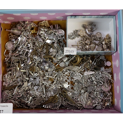 327 - Two silver charm bracelets and a large collection of charms to include: swords, skulls, binoculars, ... 