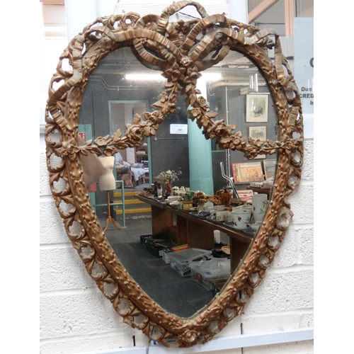 488 - 19th century gilt gesso framed heart shaped mirror, the border with pierced foliate decoration, orna... 