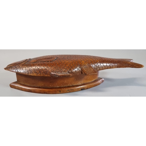 49 - Carved wooden treen lozenge shaped box with carved carp shape lid. 
(B.P. 21% + VAT)