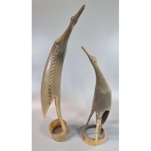 51 - Two similar carved horn figures of stylised birds. 
(B.P. 21% + VAT)