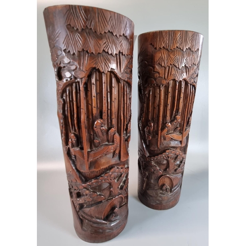 53 - Pair of Chinese bamboo brush pots, overall carved with figures within a landscape and boats. 38cm hi... 