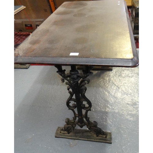 569 - Cast iron and mahogany pub type table of rectangular form.  (B.P. 21% + VAT)