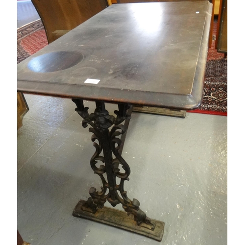 570 - Cast iron and mahogany pub type table of rectangular form.  (B.P. 21% + VAT)