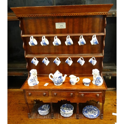 579 - Miniature stained mahogany pot board dresser with assorted miniature blue and white china.  (B.P. 21... 