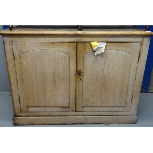 594 - Victorian stripped pine cupboard base with two arched panelled cupboards.  126cm wide approx.   (B.P... 