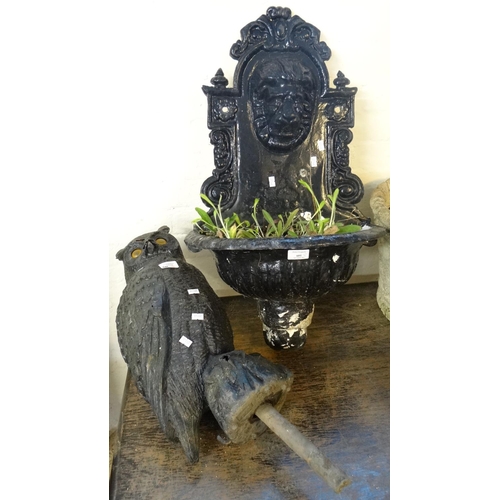 601 - Cast metal lion mask garden wall stoop/planter together with a garden owl ornament.  (2)  (B.P. 21% ... 