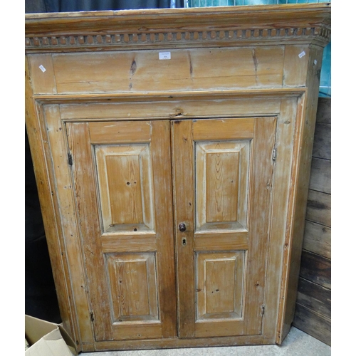 616 - 19th century stripped pine two door standing corner cupboard with dentil moulded cornice and shaped ... 