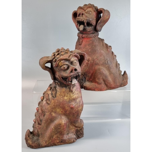 63 - Pair of oriental design seated pottery fo dogs. 
(B.P. 21% + VAT)