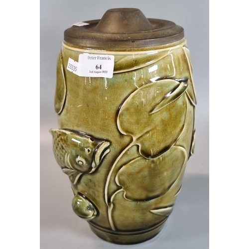 64 - Studio Art pottery barrel shaped green glazed lamp base with gilt metal lid, overall with relief dec... 