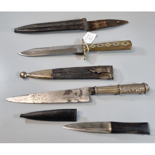 67 - Group of three sheath knives, to include: one with brass and hardwood hilt with mother of pearl inla... 