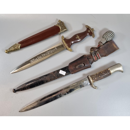 72 - Replica German WWII period SA dress dagger and scabbard together with a German Puma bayonet with sin... 