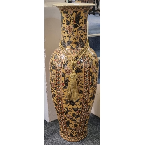 75 - Large oriental design pottery floor vase decorated with flowers and foliage on a mustard ground. 112... 