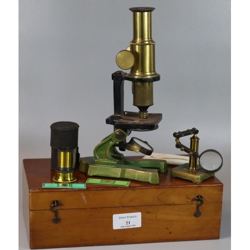 21 - Early 20th Century French brass microscope in fitted case with accessories including glass slides. 
... 