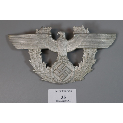 35 - World War Two German Police Shako eagle plate in aluminium marked 'GHO'.
(B.P. 21% + VAT)