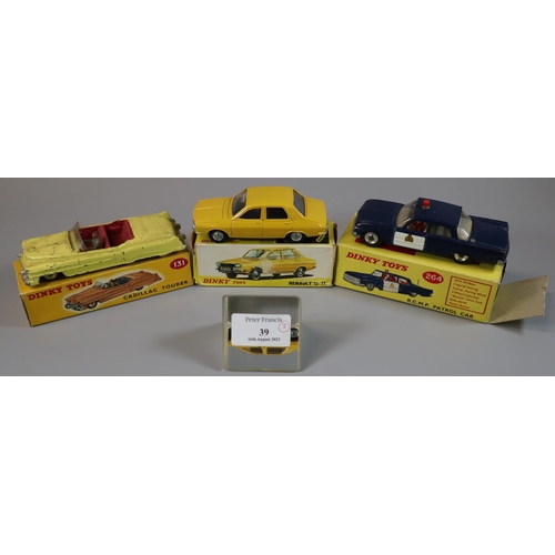 39 - Dinky toys 264 R.C.M.P. patrol car, together with a Dinky toys 131 Cadillac Tourer and a Dinky toys ... 