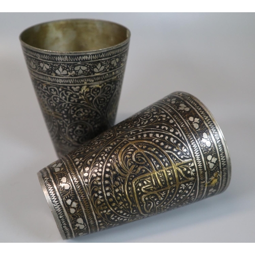 51 - A pair of Indian engraved and enamel inlaid 'Lassi' cups with gilt Islamic calligraphy. Early to mid... 