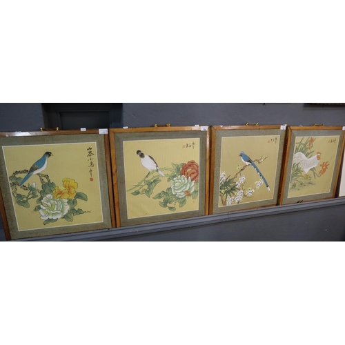 134 - Set of four Japanese printed panels on fabric depicting birds amongst blossom.  46x45cm approx.  Fra... 