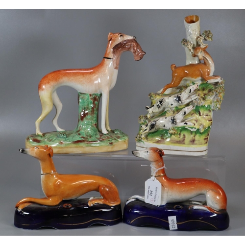 151 - Two Staffordshire Pottery seated Greyhounds, one standing carrying a rabbit and a spill vase with a ... 