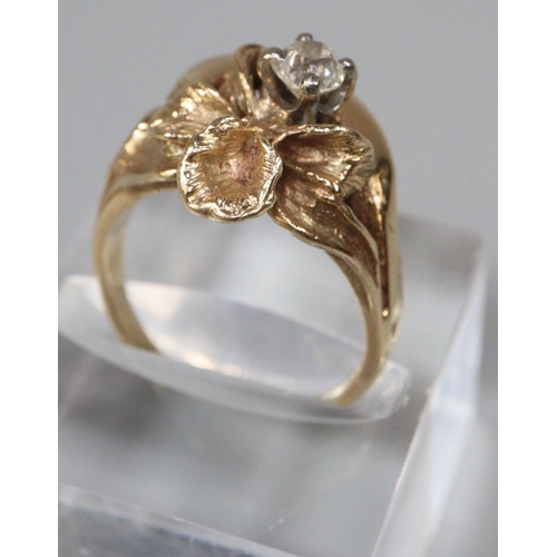 202 - Yellow metal floral design diamond solitaire ring. 6.1g approx.  Ring size J1/2.   0.2ct approx.  (B... 