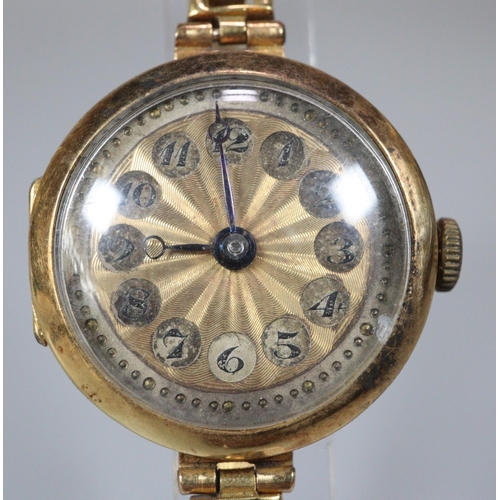 225 - 18ct gold ladies cushion shaped wristwatch with engine turned Arabic face and 18ct gold expanding br... 