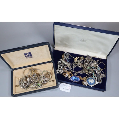 234 - Two cases of assorted costume jewellery: chain necklaces, pendants etc.  (B.P. 21% + VAT)