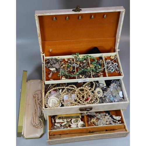 240 - Cream cantilever jewellery case containing a large assortment of costume jewellery.   (B.P. 21% + VA... 