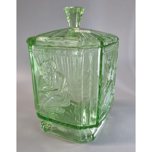 25 - Art Deco design green moulded glass biscuit barrel with figural decoration and fluted cover.  20cm h... 