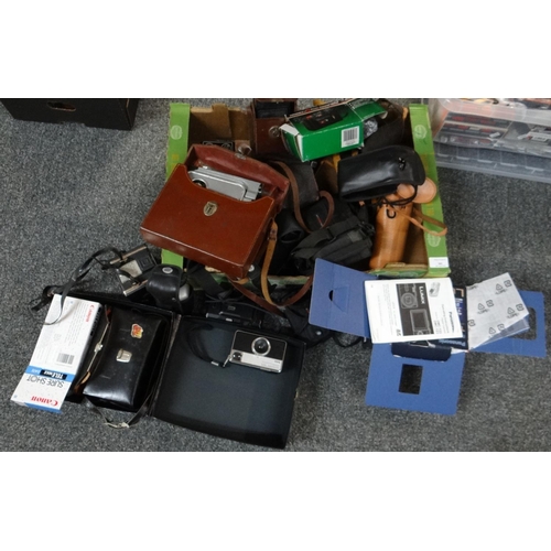 301 - Box of cameras and camera equipment to include: Kodak Instamatic 133-X, Admica 8F cinecamera in orig... 