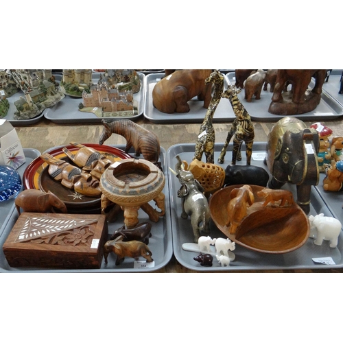 334 - Two trays of mostly animal figures to include: two Art pottery giraffes, various carved wooden eleph... 