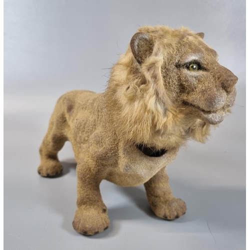 'Fairylite Beautyware' model of male lion with weighted moving head.  28.5cm long approx.  (B.P. 21% + VAT)