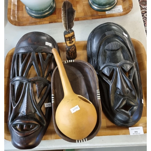 391 - Two African Tribal masks, Gourd, wooden tribal bowl and figure. (5)  (B.P. 21% + VAT)