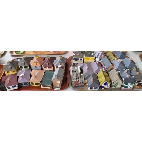 394 - Two trays of plastic model railway track side buildings together with various other model railway ac... 