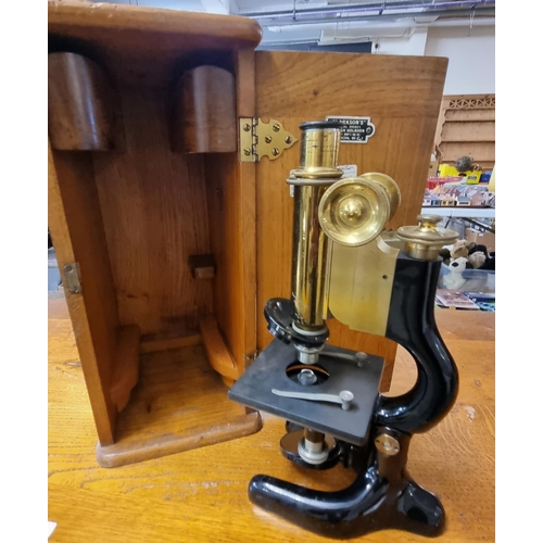 430 - Lacquered brass and enamelled monocular microscope in original box with retailer's label 'Clarkson's... 