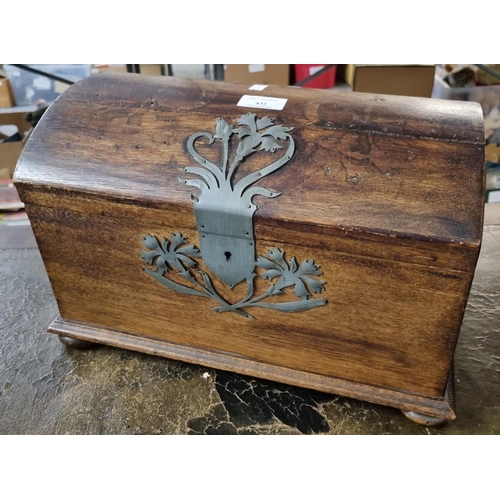 432 - Metal mounted dome topped oak casket with hinged cover and bun feet.   (B.P. 21% + VAT)