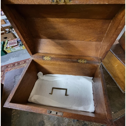 432 - Metal mounted dome topped oak casket with hinged cover and bun feet.   (B.P. 21% + VAT)