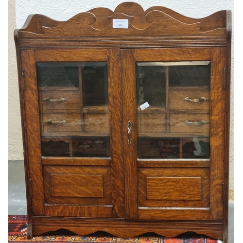 436 - Large early 20th century oak two door glazed smoker's cabinet.   (B.P. 21% + VAT)