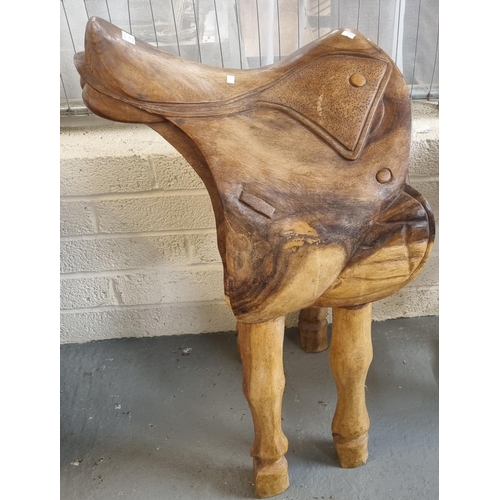 439 - Unusual hand made wooden equestrian Saddle Display Stand, carved and moulded as a saddle, on horses ... 